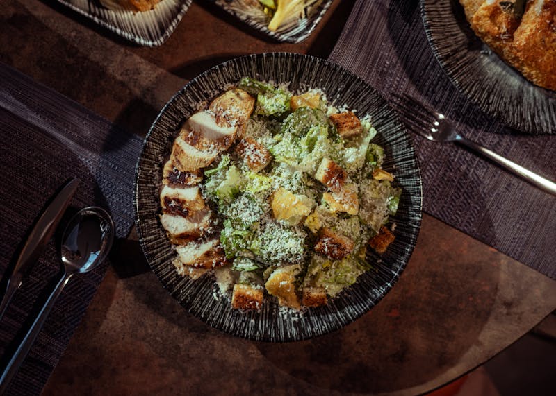 Caesar salad with croutons and parmesan shavings
