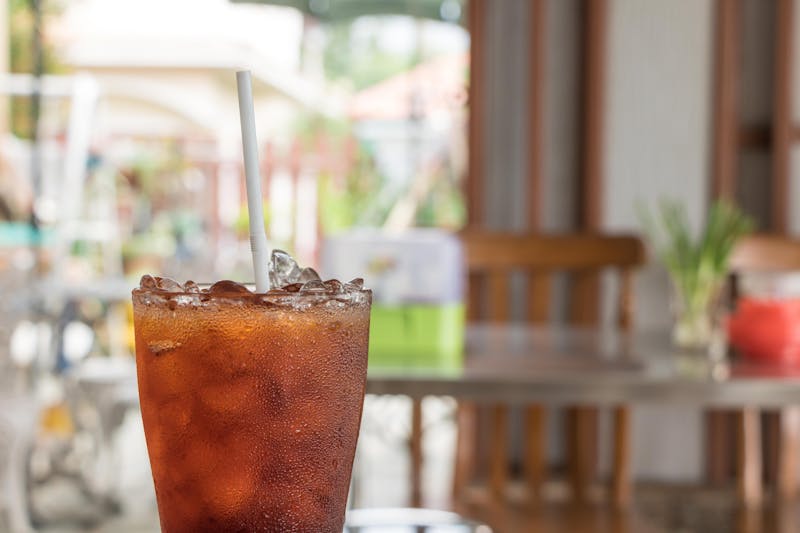 Iced tea drink with lemon and mint garnish